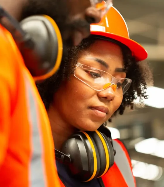 close-up-african-engineer-site-working-with-her-team-production-line-supervisor-look-check-job-factory-workplace-operation-staff-with-safety-uniform