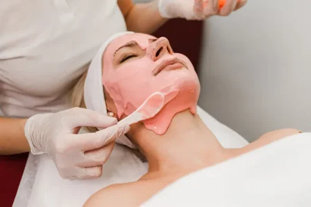 doctor-beautician-applies-anti-aging-mask-woman-face