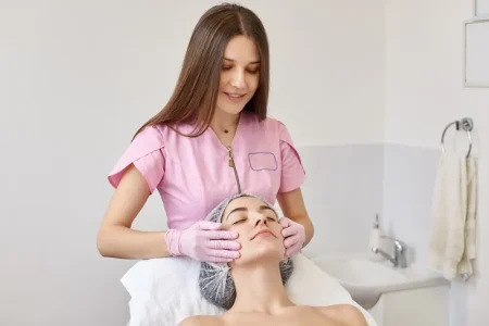 image-careful-positive-cosmetologist-making-anti-wrinkle-facial-massage