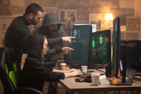 team-hackers-pointing-computer-screen-female-cyber-terrorist